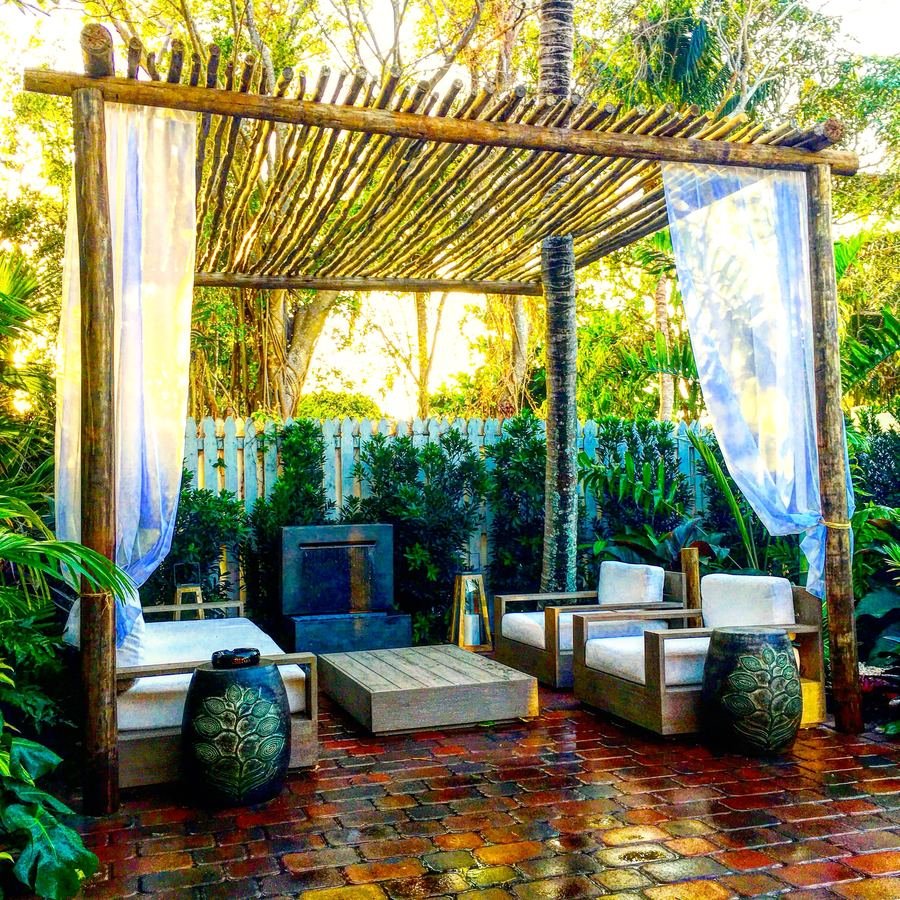 Bamboo cabana lounge with tropical plantings