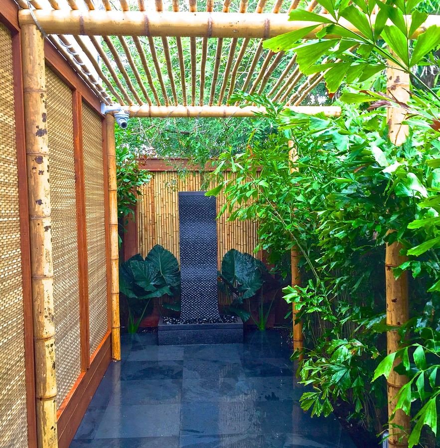 Bamboo corridor with a water feature in Miami
