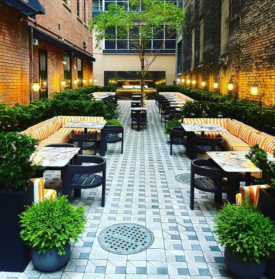 Daphne restaurant courtyard in Toronto with lush plantings
