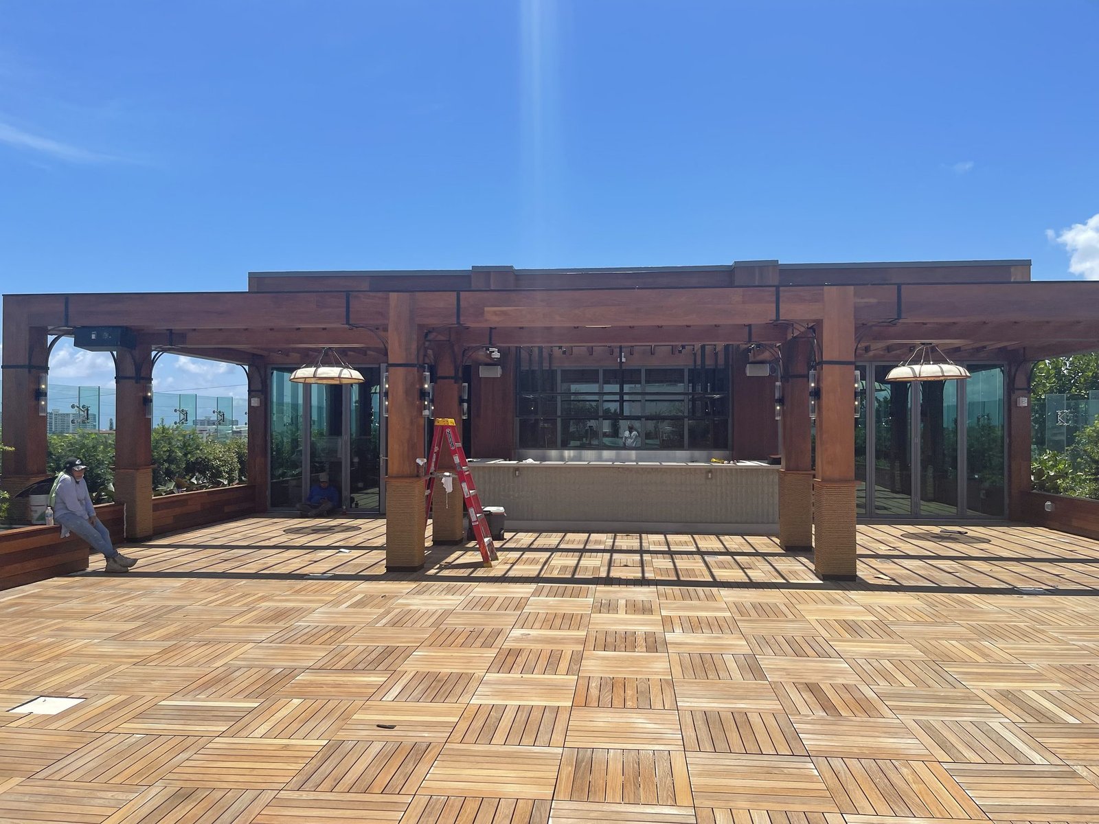 The Ray Hotel rooftop terrace before biophilic design, a bare wooden deck
